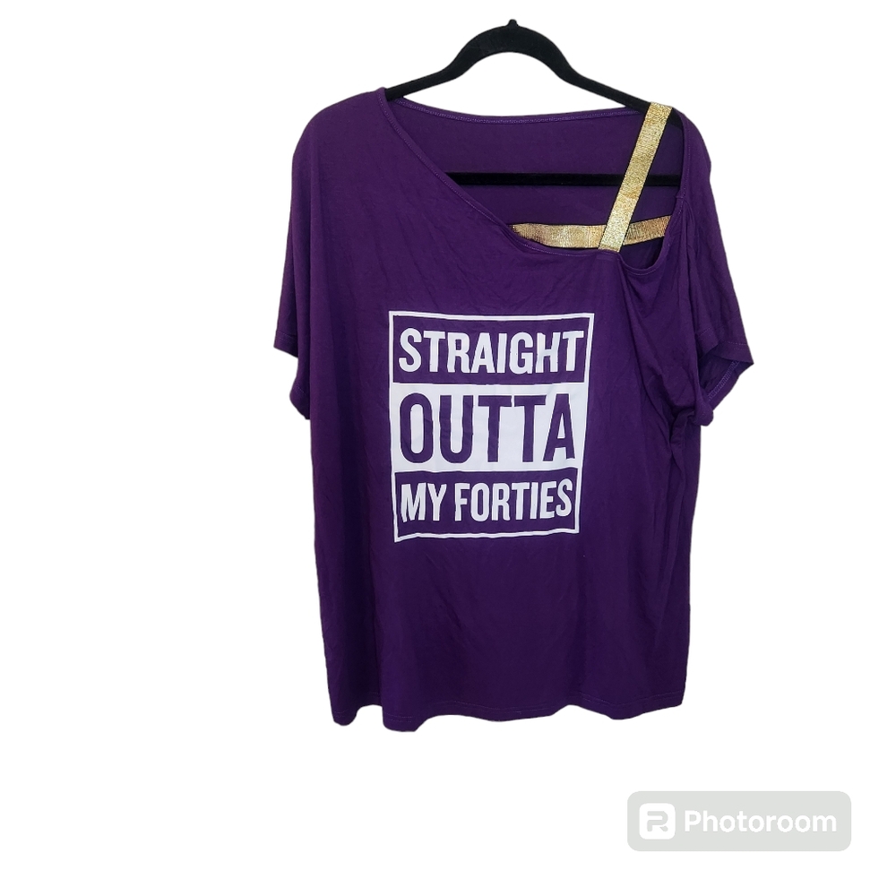 Graphic purple tee with gold shoulder straps. Straight out of my forties.